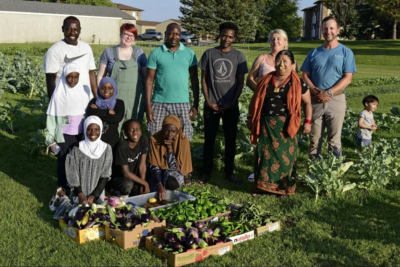 Fieldway residents and volunteers at the allotments with freshly grown vegetables