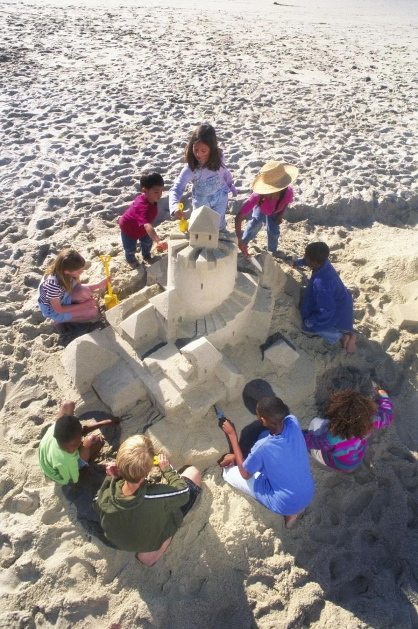 Children playing together on a community day out trip